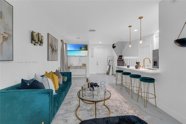 1901 SW 60th Ter, North Lauderdale, FL 33068 - living room featuring light marble finish flooring, stairs, baseboards, and recessed lighting