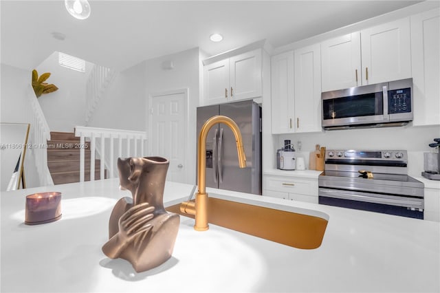1901 SW 60th Ter, North Lauderdale, FL 33068 - kitchen featuring stainless steel appliances, light countertops, white cabinets, and recessed lighting