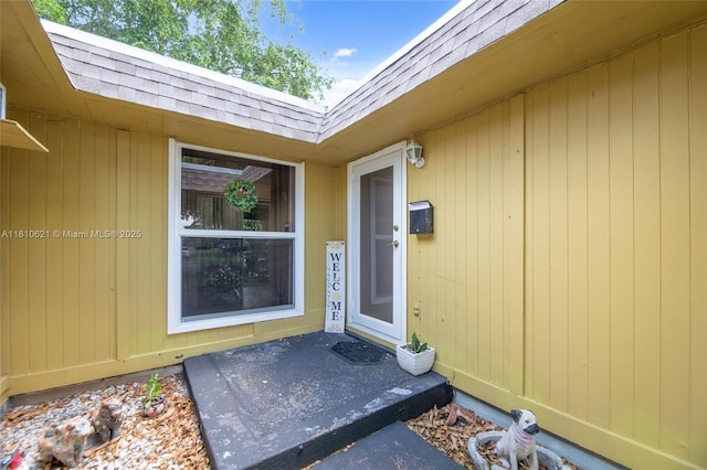 7201 NW 67th St, Tamarac, FL 33321 - view of exterior entry with roof with shingles and mansard roof