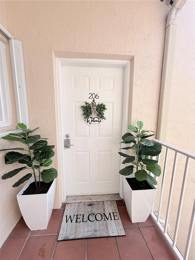 15741 SW 137th Ave Unit 206, Miami, FL 33177 - doorway to property with stucco siding