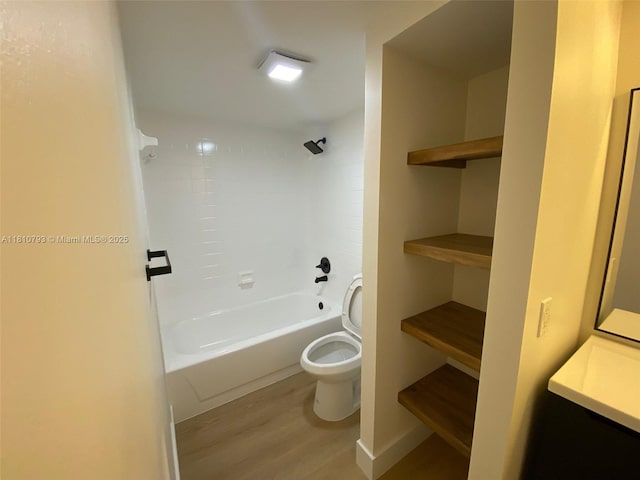 120 Heritage Way, West Palm Beach, FL 33407 - bathroom with toilet, wood finished floors, washtub / shower combination, and vanity