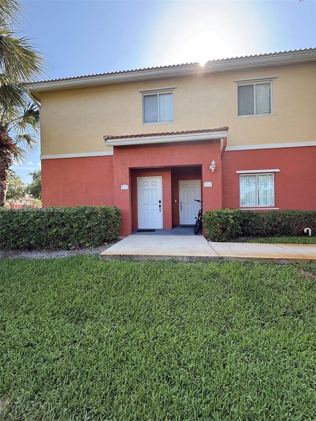 3340 Palomino Dr Unit 211-2, Davie, FL 33024 - view of front of home featuring a front lawn and stucco siding