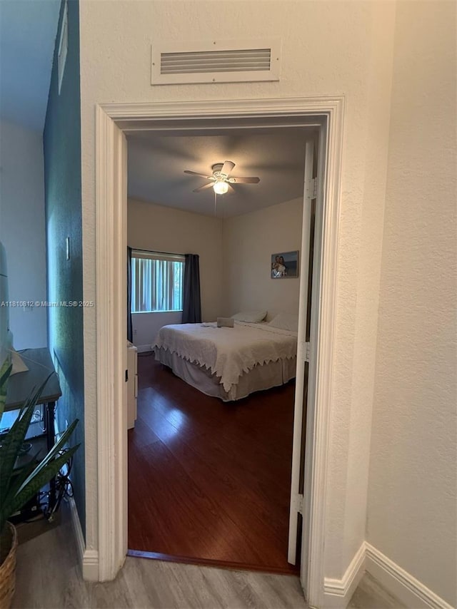 3340 Palomino Dr Unit 211-2, Davie, FL 33024 - bedroom with wood finished floors, baseboards, and ceiling fan