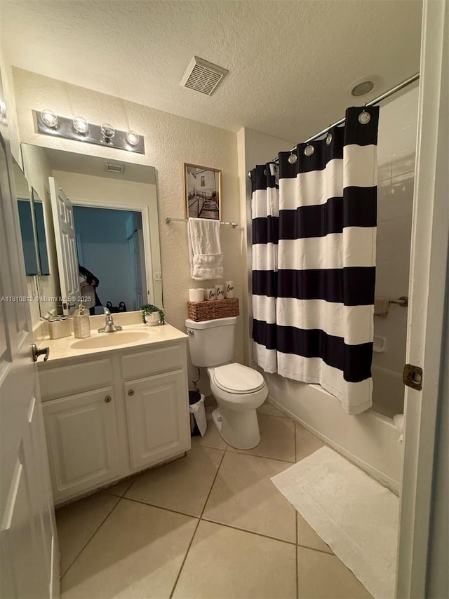 3340 Palomino Dr Unit 211-2, Davie, FL 33024 - full bath featuring vanity, toilet, tile patterned flooring, a textured ceiling, and shower / bath combination with curtain