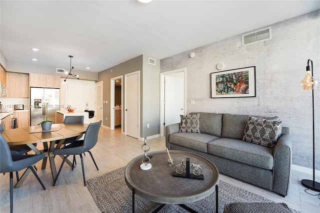 3900 Biscayne Blvd Unit S-218, Miami, FL 33137 - living area with light wood finished floors, baseboards, recessed lighting, and a chandelier