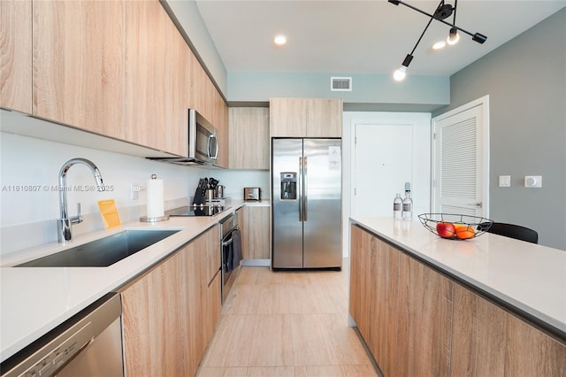 3900 Biscayne Blvd Unit S-218, Miami, FL 33137 - kitchen with appliances with stainless steel finishes, modern cabinets, a sink, light brown cabinetry, and recessed lighting
