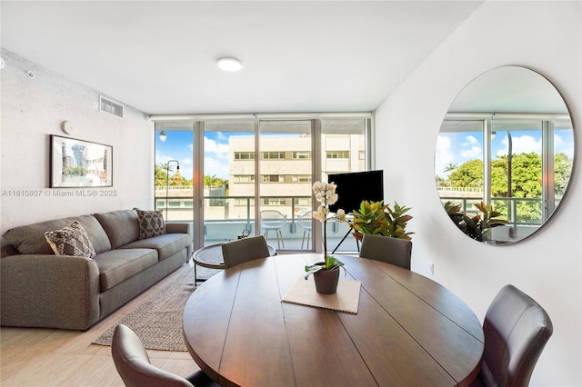 3900 Biscayne Blvd Unit S-218, Miami, FL 33137 - dining room with wood finished floors and expansive windows