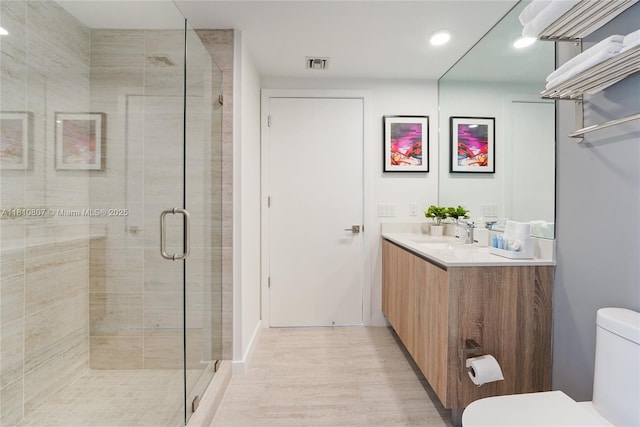 3900 Biscayne Blvd Unit S-218, Miami, FL 33137 - bathroom with vanity, toilet, a shower stall, and recessed lighting