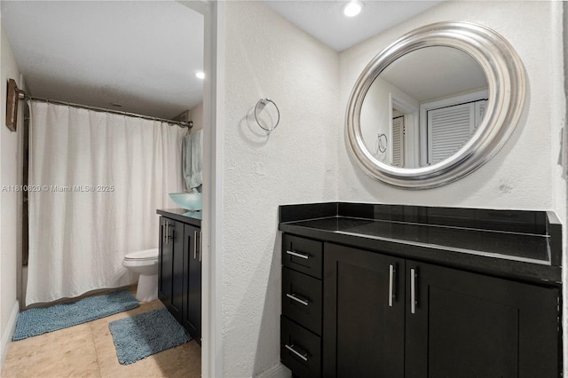 500 Three Islands Blvd Unit 1112, Hallandale Beach, FL 33009 - full bathroom featuring vanity, a textured wall, toilet, and shower / bathtub combination with curtain