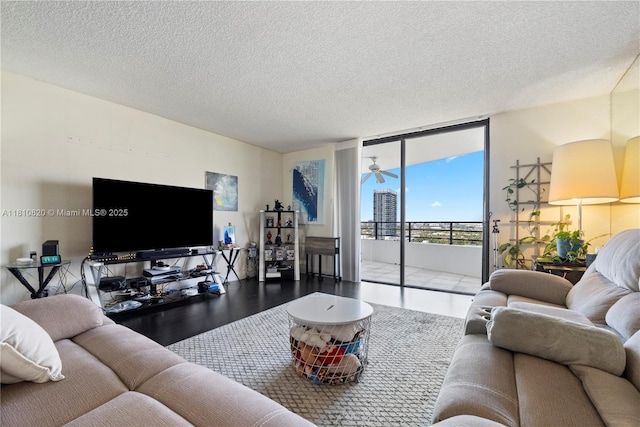 500 Three Islands Blvd Unit 1112, Hallandale Beach, FL 33009 - living room with expansive windows and a textured ceiling