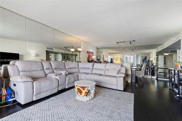 500 Three Islands Blvd Unit 1112, Hallandale Beach, FL 33009 - living area with wood finished floors, a textured ceiling, and track lighting