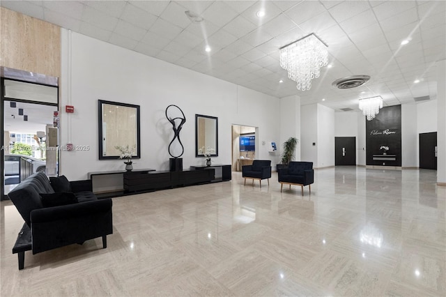 500 Three Islands Blvd Unit 1112, Hallandale Beach, FL 33009 - building lobby featuring a towering ceiling and a paneled ceiling