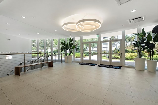 500 Three Islands Blvd Unit 1112, Hallandale Beach, FL 33009 - building lobby featuring a wall of windows and recessed lighting