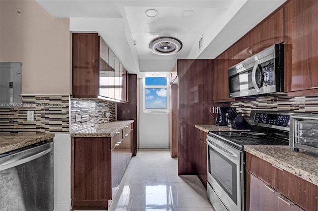 5077 NW 7th St Unit 1517, Miami, FL 33126 - kitchen with appliances with stainless steel finishes, tasteful backsplash, modern cabinets, and light stone counters