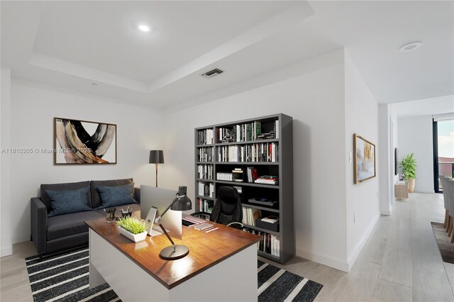 45 SW 9th St Unit 2105, Miami, FL 33130 - living room featuring light wood-style flooring, an office area, a tray ceiling, baseboards, and recessed lighting