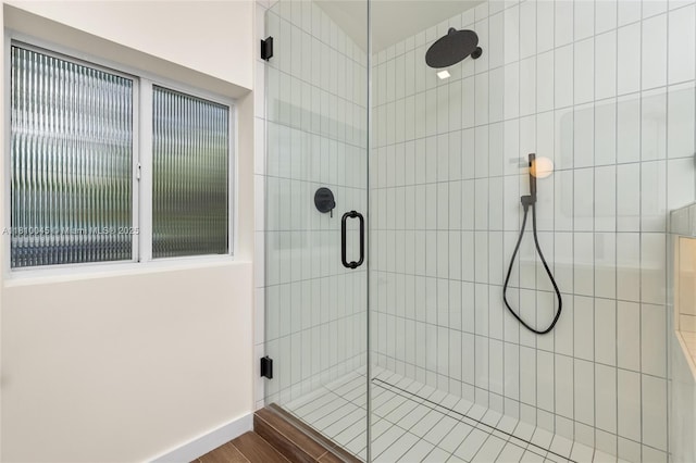 266 NW 42nd St, Miami, FL 33127 - bathroom with a stall shower and baseboards