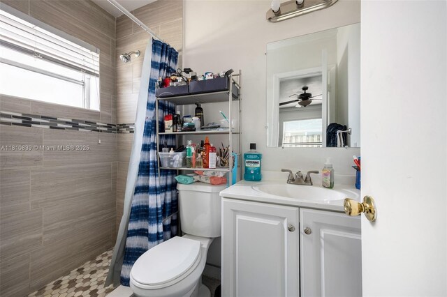 3430 N 65th Ave, Hollywood, FL 33024 - bathroom with a tile shower, toilet, vanity, and a ceiling fan