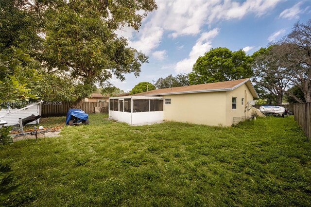 3430 N 65th Ave, Hollywood, FL 33024 - back of property featuring a sunroom and stucco siding