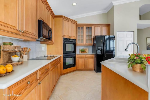 4506 SW 186th Way, Miramar, FL 33029 - kitchen with black appliances, light countertops, backsplash, crown molding, and a sink