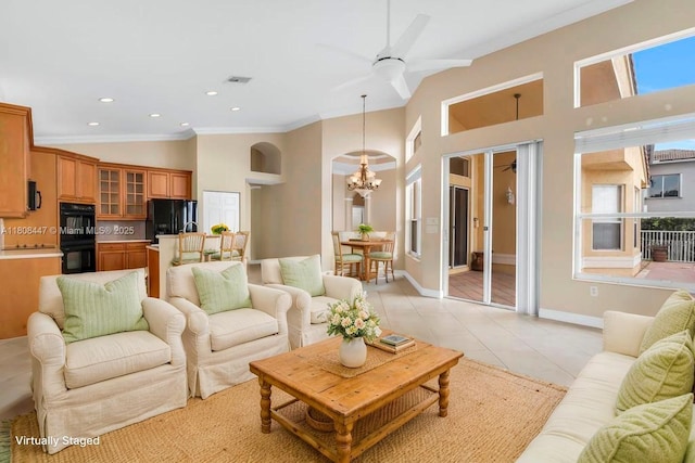 4506 SW 186th Way, Miramar, FL 33029 - living area featuring a chandelier, crown molding, a towering ceiling, a ceiling fan, and recessed lighting