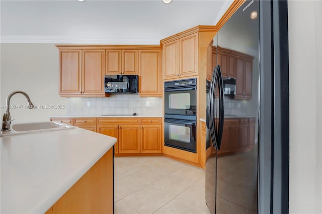 4506 SW 186th Way, Miramar, FL 33029 - kitchen featuring black appliances, a sink, light countertops, backsplash, and light tile patterned flooring