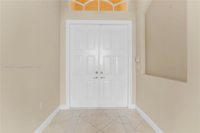 4506 SW 186th Way, Miramar, FL 33029 - entryway with light tile patterned flooring, baseboards, and arched walkways