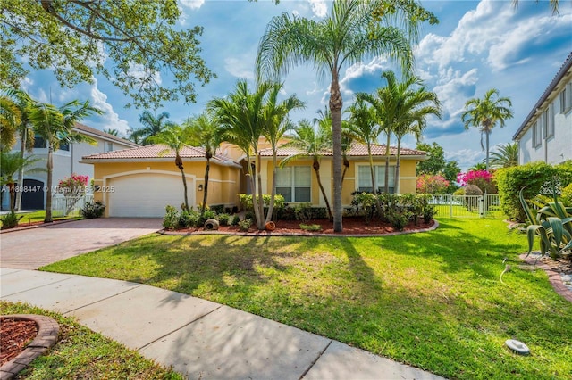 4506 SW 186th Way, Miramar, FL 33029 - mediterranean / spanish-style house with stucco siding, an attached garage, decorative driveway, and a tiled roof