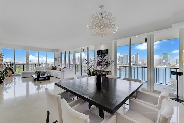 1000 Venetian Way Unit 1304, Miami, FL 33139 - dining room with a chandelier, a wall of windows, and a skyline view