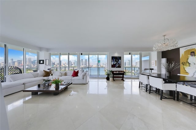 1000 Venetian Way Unit 1304, Miami, FL 33139 - living area featuring a chandelier, healthy amount of natural light, a view of skyline, and expansive windows