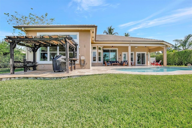 15122 SW 34th St, Davie, FL 33331 - back of house featuring a pergola, a tile roof, stucco siding, a ceiling fan, and a patio