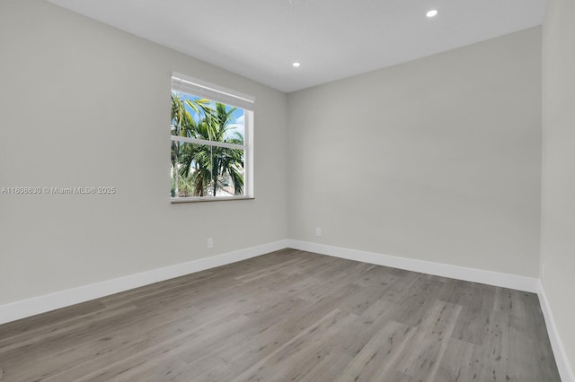 4123 Parkside Dr, Jupiter, FL 33458 - unfurnished room featuring baseboards, wood finished floors, and recessed lighting