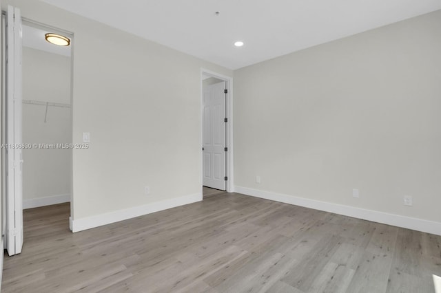 4123 Parkside Dr, Jupiter, FL 33458 - spare room featuring wood finished floors, baseboards, and recessed lighting