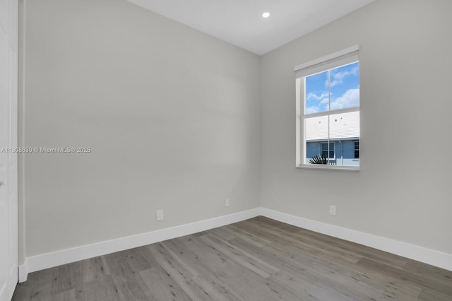 4123 Parkside Dr, Jupiter, FL 33458 - empty room with wood finished floors, baseboards, and recessed lighting
