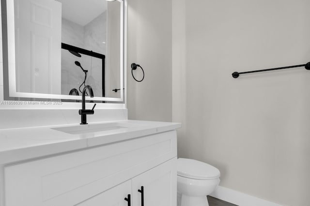 4123 Parkside Dr, Jupiter, FL 33458 - full bath featuring toilet, vanity, baseboards, and a shower