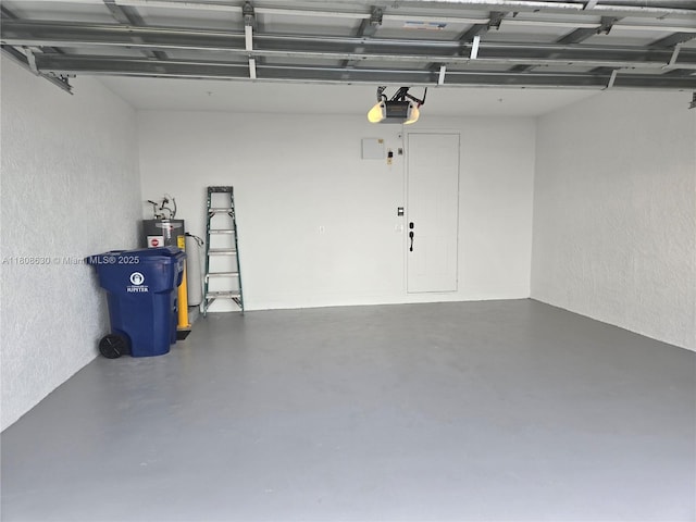 4123 Parkside Dr, Jupiter, FL 33458 - garage featuring a textured wall, water heater, and a garage door opener