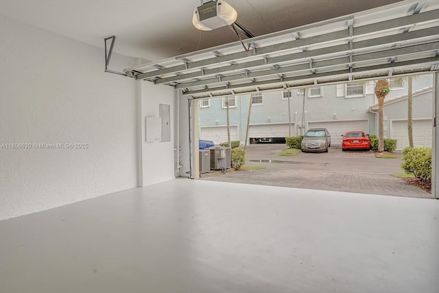 4123 Parkside Dr, Jupiter, FL 33458 - garage with a garage door opener and electric panel
