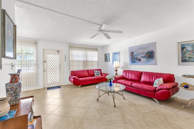 2002 Lyndhurst H Unit 2002, Deerfield Beach, FL 33442 - living area with ceiling fan, a textured ceiling, tile patterned floors, and baseboards