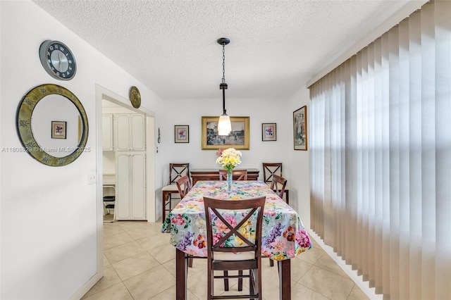2002 Lyndhurst H Unit 2002, Deerfield Beach, FL 33442 - dining area with light tile patterned flooring and a textured ceiling