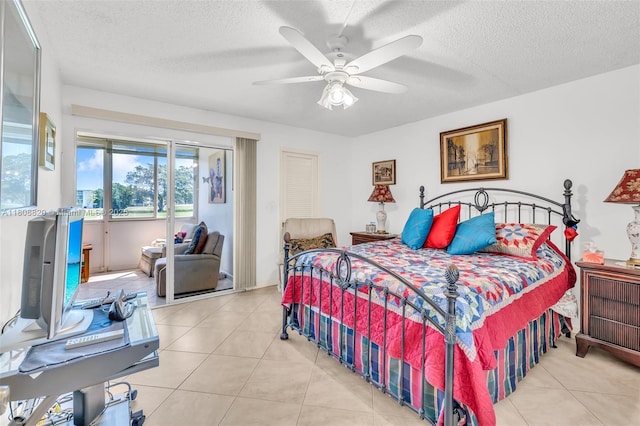 2002 Lyndhurst H Unit 2002, Deerfield Beach, FL 33442 - tiled bedroom featuring a textured ceiling, access to outside, and ceiling fan