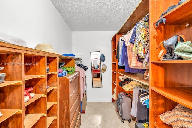 2002 Lyndhurst H Unit 2002, Deerfield Beach, FL 33442 - walk in closet featuring tile patterned flooring
