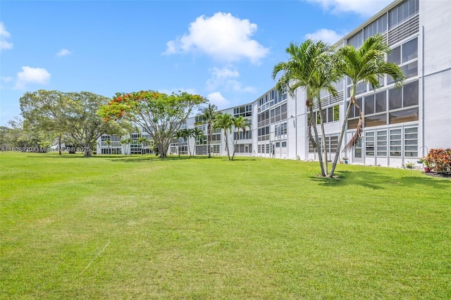 2002 Lyndhurst H Unit 2002, Deerfield Beach, FL 33442 - view of home's community with a yard