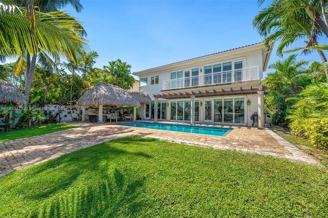 425 N Shore Dr, Miami Beach, FL 33141 - rear view of property featuring a gazebo, stucco siding, a lawn, and a patio area