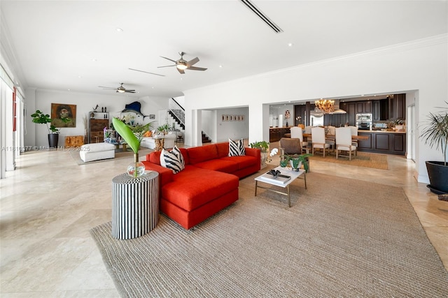 425 N Shore Dr, Miami Beach, FL 33141 - living room with ornamental molding, stairway, a ceiling fan, and a chandelier