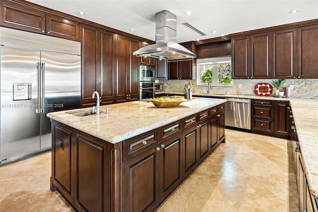 425 N Shore Dr, Miami Beach, FL 33141 - kitchen with built in appliances, a sink, island exhaust hood, a kitchen island with sink, and decorative backsplash
