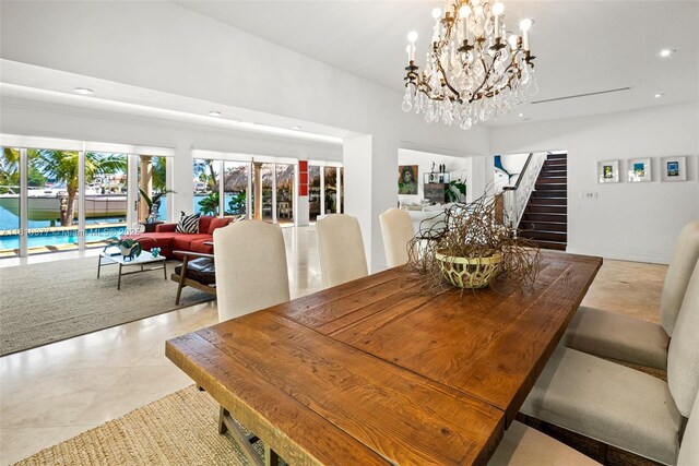 425 N Shore Dr, Miami Beach, FL 33141 - dining space with stairway, recessed lighting, and a chandelier
