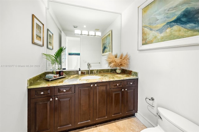 425 N Shore Dr, Miami Beach, FL 33141 - bathroom with toilet, tile patterned flooring, vanity, and baseboards