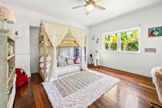 425 N Shore Dr, Miami Beach, FL 33141 - bedroom featuring baseboards, wood finished floors, and ceiling fan