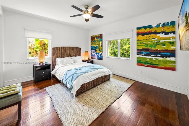 425 N Shore Dr, Miami Beach, FL 33141 - bedroom featuring baseboards, wood-type flooring, and ceiling fan