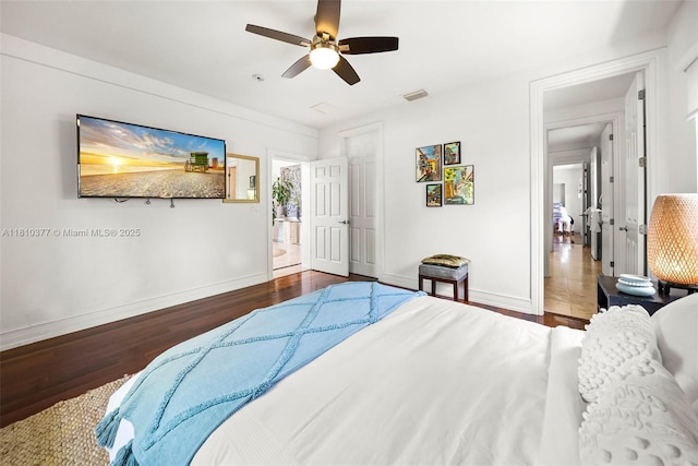 425 N Shore Dr, Miami Beach, FL 33141 - bedroom with baseboards, wood finished floors, and ceiling fan