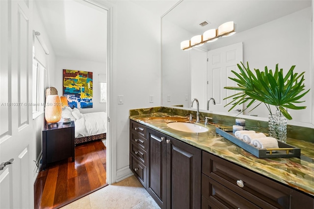 425 N Shore Dr, Miami Beach, FL 33141 - bathroom featuring vanity, ensuite bath, and tile patterned flooring
